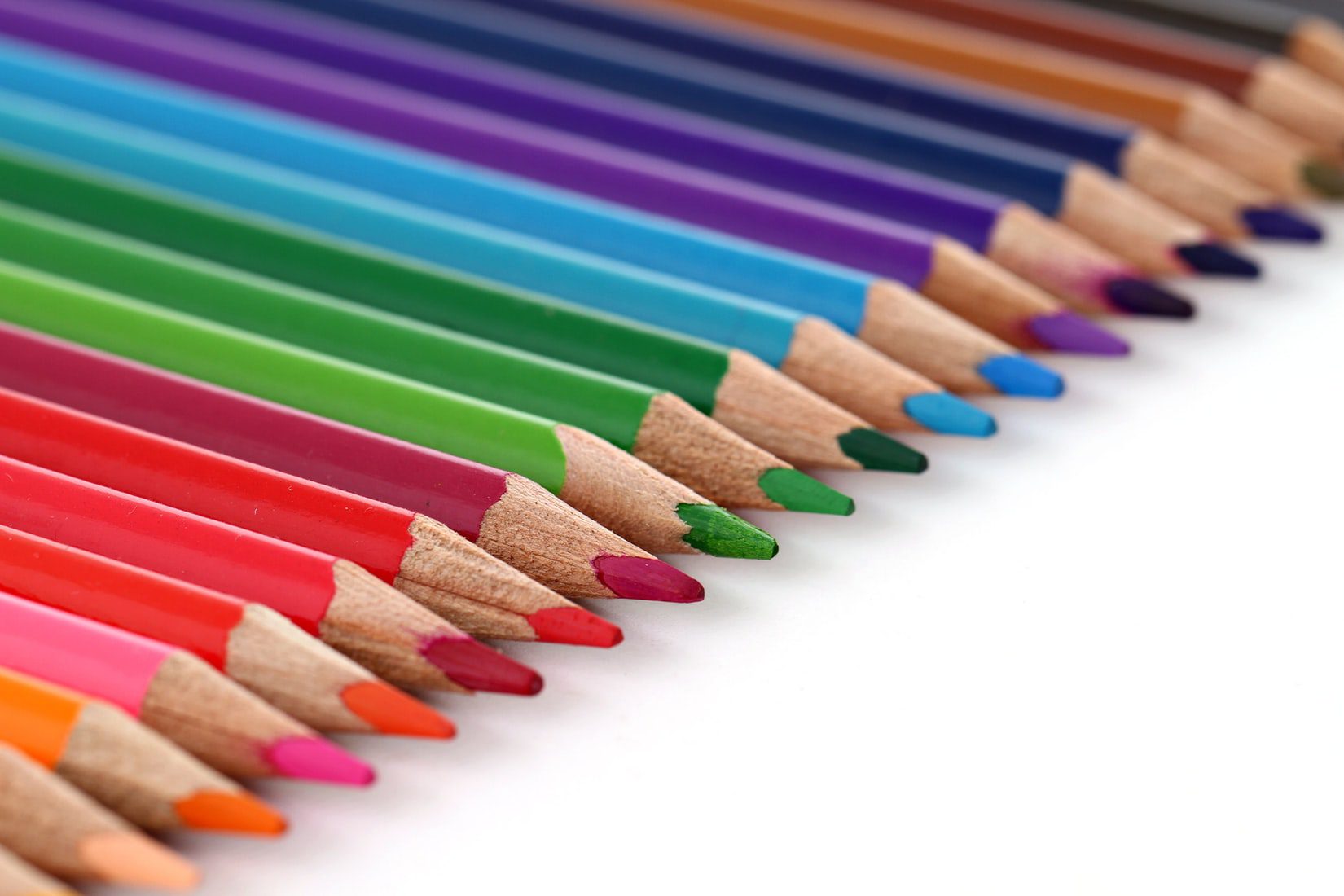 Colored pencils lined up, ready to be used with the right audience