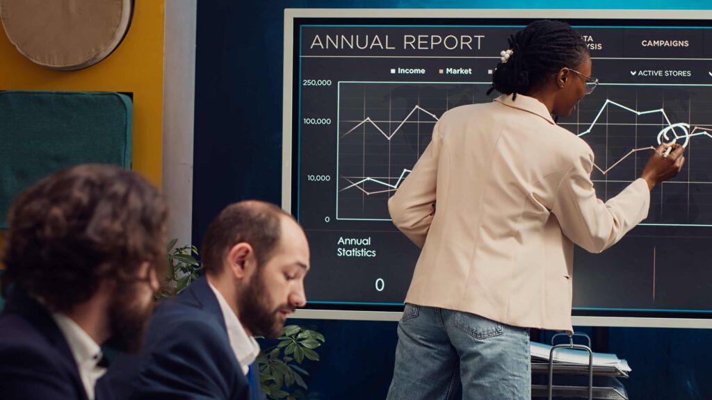 Working showing annual reports for entertainment marketing strategy on social media